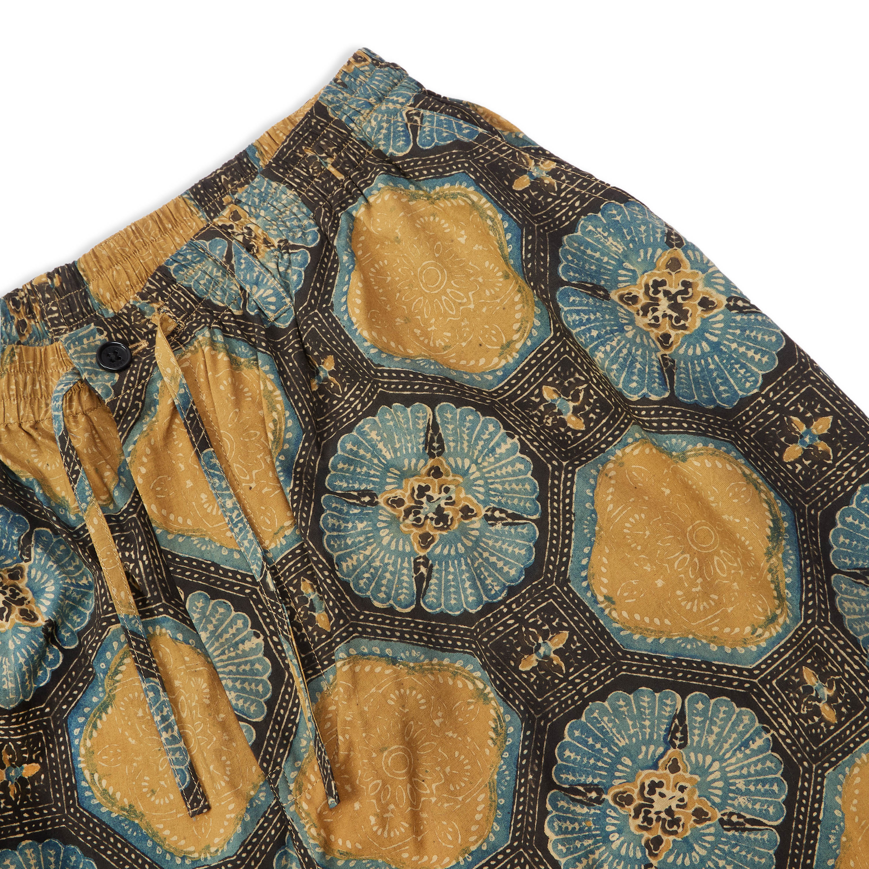 Close-up of Milo Drawstring Shorts by Kardo displaying Ajrakh print details.