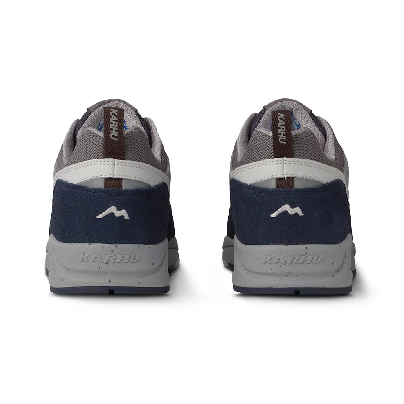 Detailed view of the embroidered M-logo and reflective accents on the heel of Karhu Fusion 2.0 trainers.