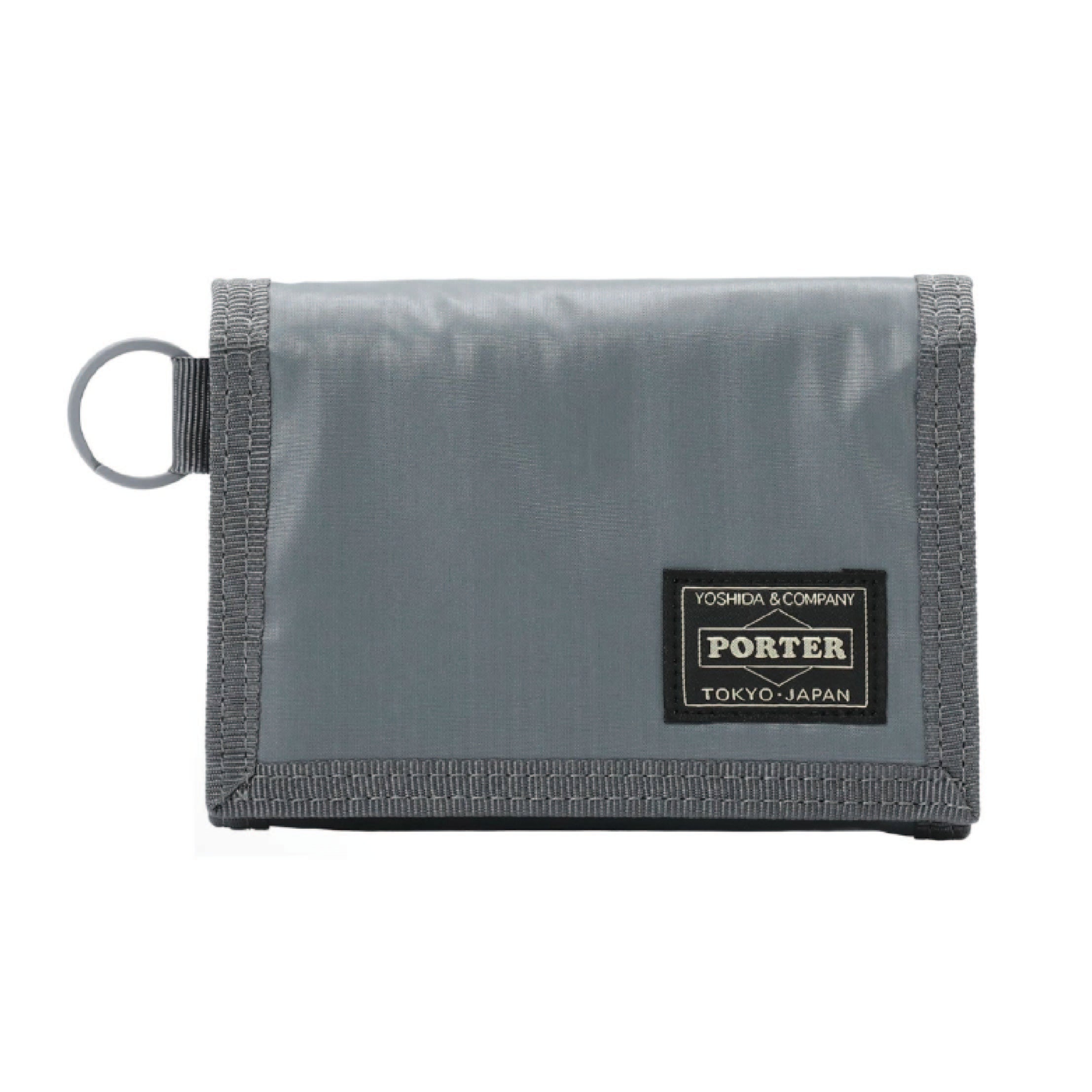 Porter Yoshida & Co. Capsule Wallet in gray — front view showing compact zip-around form and embossed Porter branding